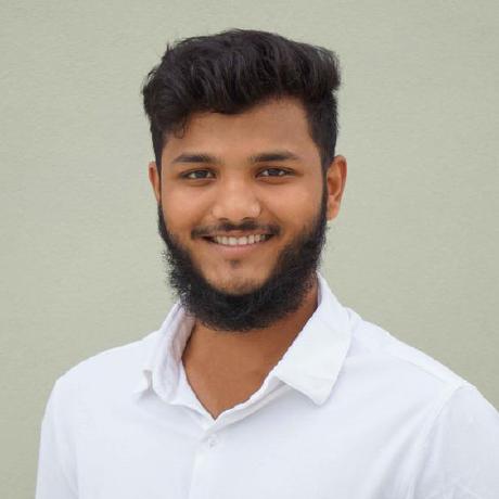 Mahaboob Ashraf smiling in a white shirt